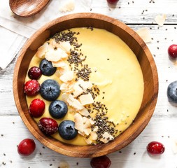 Overhead view of Breakfast mango smoothie bowl / Healthy eating concept
