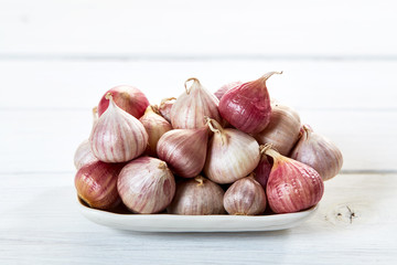 Fresh healthy garlic on white table