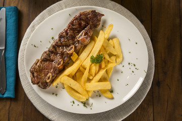 Ribs streak with french fried. A rib steak is a beef steak sliced from the rib primal of a beef animal, with rib bone attached.