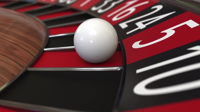 Casino roulette wheel ball hits 5 five red