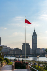Huangpu river sunset view with Chinese flag in Shanghai, China