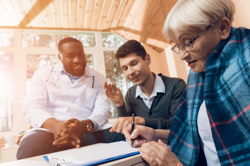 Fototapeta premium An elderly woman bequeaths her house to a young man.