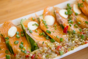 Spicy fresh sliced salmon sashimi close up.