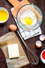 cooking pancake on wooden background top view ingredients for ma