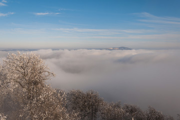 Obraz na płótnie Canvas misty frosty snow winter landscape in nature, mist flowing, foggy winter landscape from Julianus tower 
