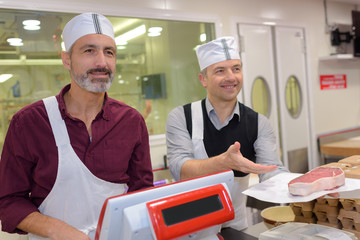 team of two male butchers