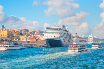 Luxury cruise ship in Bosporus against galata tower, Istanbul