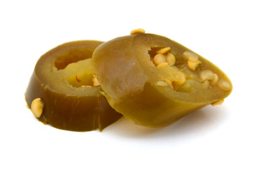 Slices of preserved Jalapeno pepper on a white background