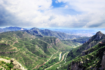 Fototapeta na wymiar The Mountain of Montserrat (Catalonia, Spain). Montserrat mountains and Benedictine monastery of Santa Maria de Montserrat.
