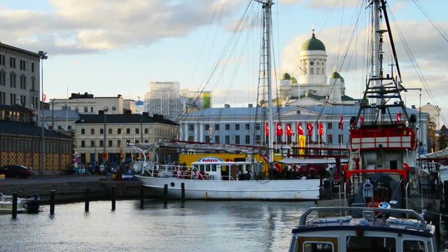 Helsinki, Finland. Port of Helsinki, Finland in the evening, fast pacing clouds over the Cathedral