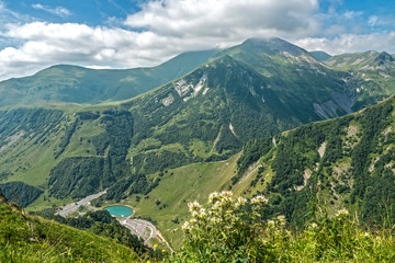 Fototapeta na wymiar Beautiful summer mountain landscape with lake below