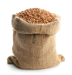 Bag with buckwheat on white background