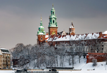 Wawel Cathedral towers in Krakow, Poland in a cloudy day in winter in last sunset light before the snowfall