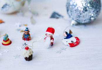 Old vintage christmas toys on white wooden background