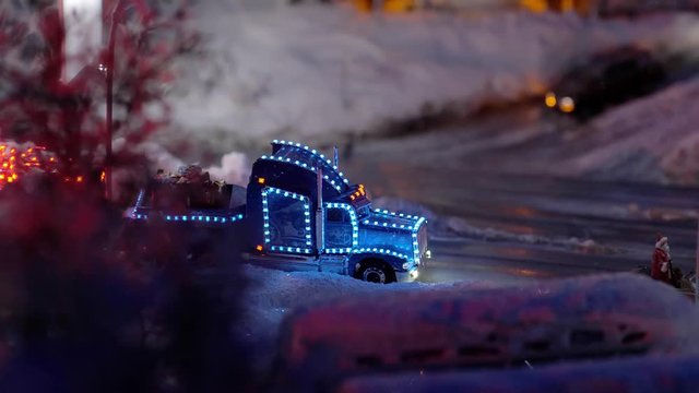 Christmas and New Year greeting card with gifts delivery stands on winter road in snow xmas eve. Slow motion. 3840x2160
