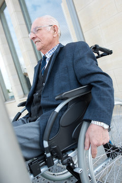 elegant senior man in wheelchair