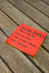 Fototapeta na wymiar List of new years resolution written on sticky notes