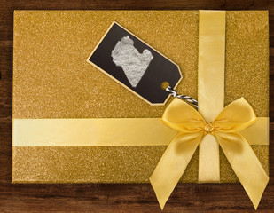 A gift box with Libya drawn on a label with chalk.(series)