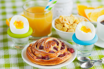 Soft boiled chicken egg, coffee, muesli and orange juice
