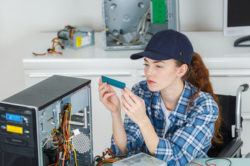 female technician repairing a computer