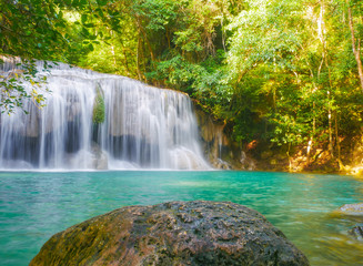 Fototapeta na wymiar Erawan Waterfall, an outdoor waterfall in the evergreen forest.