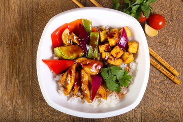 Wok with rice, cheese and tofu