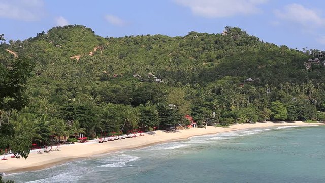 KOH PHANGAN,THAILAND - NOVEMBER 21, 2015: Thong Nai Pan Noi beach and sea water waves. Koh Phangan Island is one of the most popular destinations for tourists