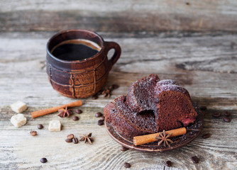chocolate cupcake with strawberries and coffee mug