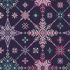 Knitted seamless multi-colored pattern of snowflakes
