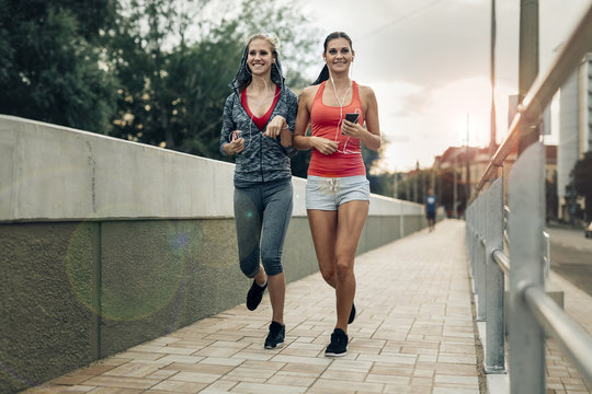 Active female joggers running outdoors