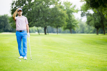 Golfer practicing and concentrating before and after shot