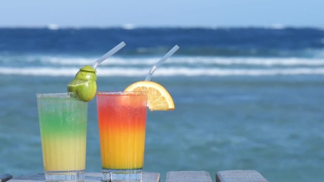Two alcoholic cocktail on the background of the sea.