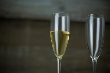 Full and empty glass of champagne