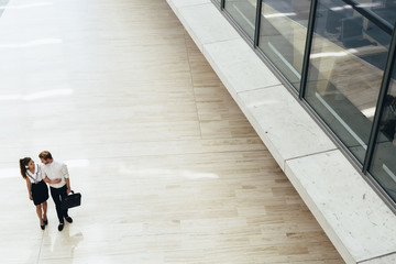 Business couple walking together