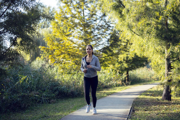 Fototapeta premium Fit woman jogging in nature
