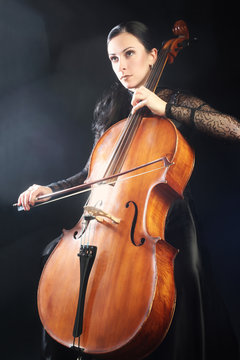 Woman playing cello player. Cellist  violoncello