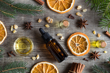 Selection of essential oils with Christmas spices and ingredients