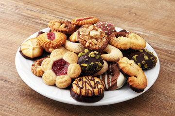 Plate with tasty fresh Christmas cookies on  table