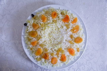Piping hot pilau on a plate . Sultana , dried apricots , rice . Pilaff . Pilau . Pilaw