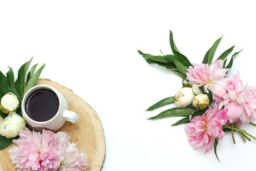 Composition on a white background of flowers and mugs with coffee. Flat lay, creative layout