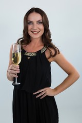 Smiling woman holding glass of champagne