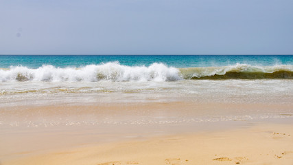 Fototapeta na wymiar Waves breaking on Santa Monica Beach, Boa Vista, Cape Verde