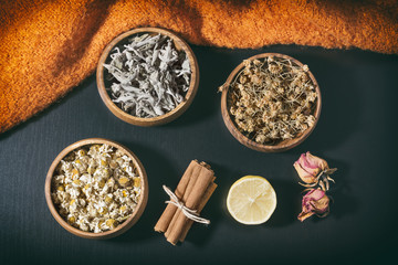 Arrangement Of Herbal Teas On A Dark Wooden Surface