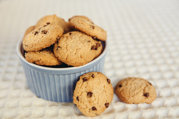 Chocolate chip cookies in little blue bowl