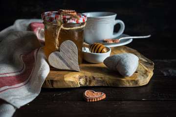 Cup of tea with lemon and heart shaped cookies