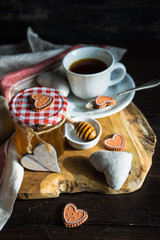 Cup of tea with lemon and heart shaped cookies