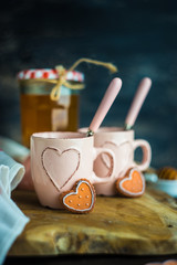 Cup of tea with lemon and heart shaped cookies