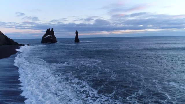 Aerial footage of troll toes on black beach. Reynisdrangar, Vik, Iceland. Landscape photography