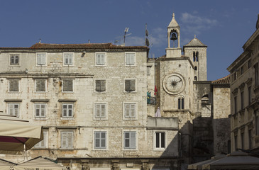 Fototapeta premium Architectural view of ancient buildings in Narodni square in Split, with its famous tower clock