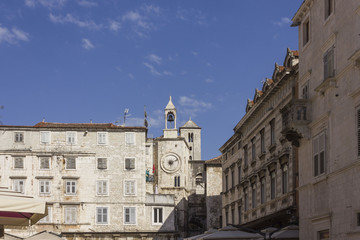 Architectural view of ancient buildings in Narodni square in Split, with its famous tower clock